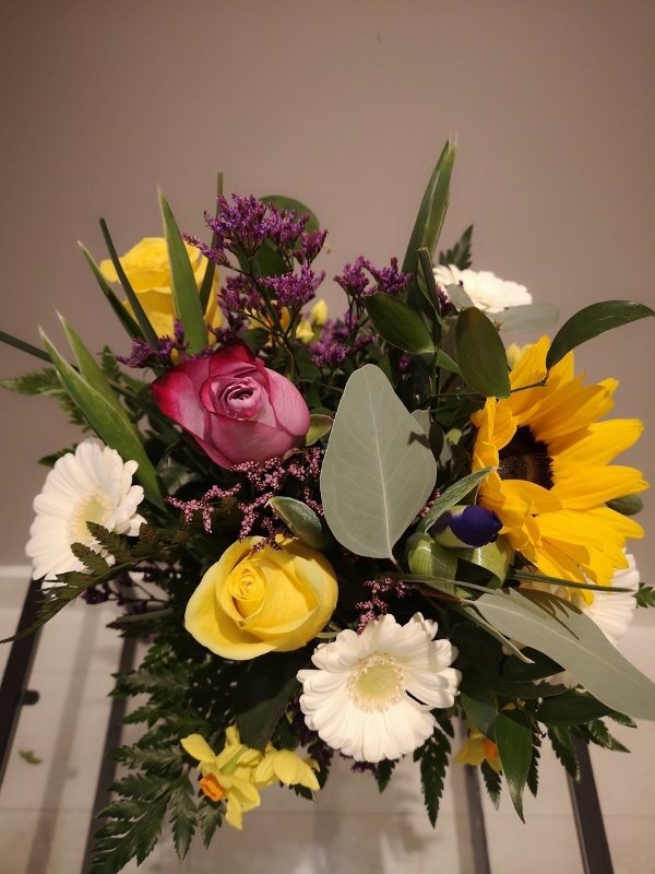 Bright flowers in a glass vase arranged by local florist in Croydon