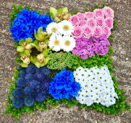 Mixed grouped flowers funeral patchwork cushion to include thisles, daisies, Cymbidium, roses, moss.