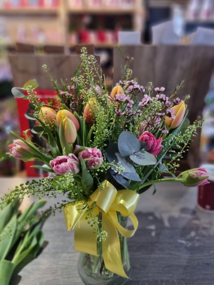 tulips bouquet with euclypthus in vase arranged by local florist in Croydon