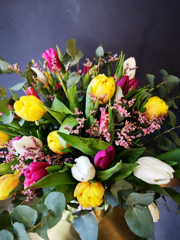 tulips bouquet with euclypthus in vase arranged by local florist in Croydon