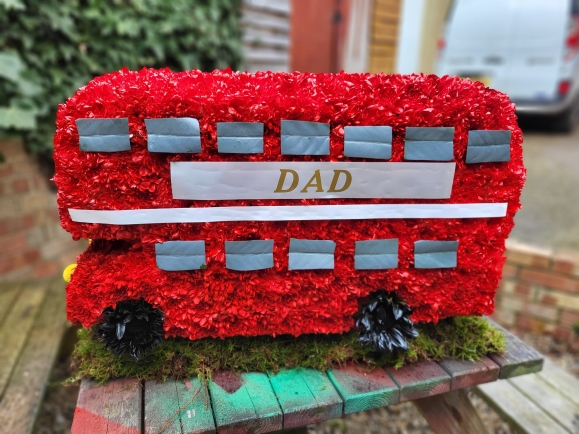 double decker funeral flowers bus by Croydon Blooms Florist