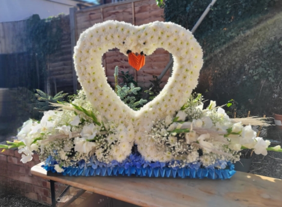 funeral flowers swan tribute by Croydon Blooms