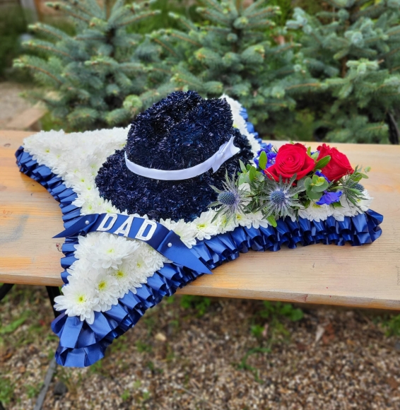 Black gentlemen hat on based cushion.