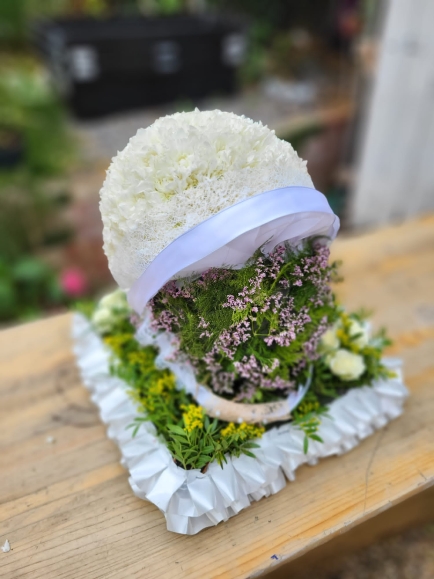 Real size helmet made of basing chrysanthemum. By Croydon Blooms Florist