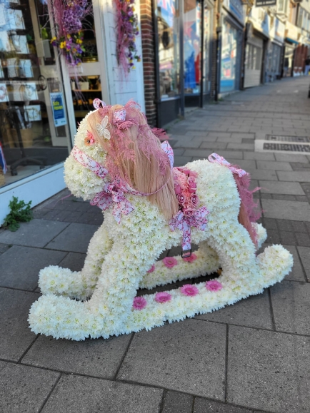 Real size rocking horse based in white chrysanthemums, colours and style can be changed. by Croydon Blooms Florist