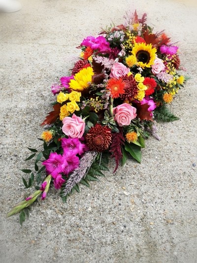 Autumn Teardrop Spray to include sunflowers, gladiolus, blooms, pink roses, oak, heather, berries.