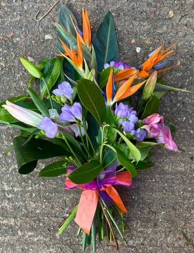 Mix of flowers to include Bird of Paradise and matching lilac and pink flowers by Croydon Blooms florist