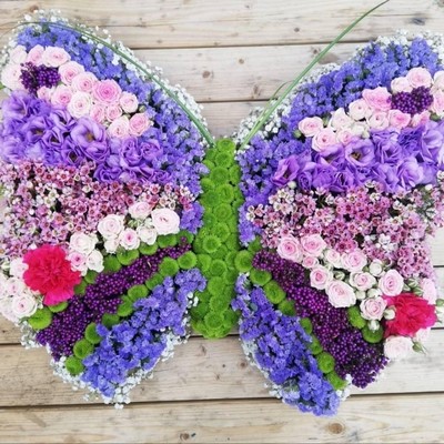 Funeral flowers shaped butterflies made by florist in Croydon, Surrey