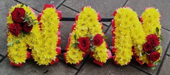 yellow based funeral letters by florist in Croydon