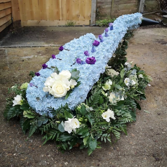 Funeral flowers saxophone on designer board, colours can be personalised. Any musical instrument or object can be done similar way. By Croydon Blooms Florist