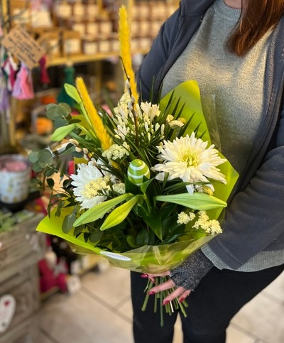 Longi lily, pussy willow, eucalyptus, yellow grass, egg pick, agapanthus, limonium and blooms wrap perfect for a vase. Made by florist in Croydon 