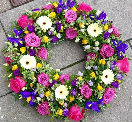 mixed flowers funeral wreath by Croydon Blooms florist