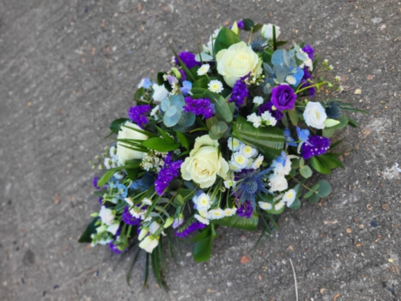 Mixed flowers teardrop to include white roses and purple limonium, lisantuh, delphinims, thisle and eucalyptus by Croydon Blooms
