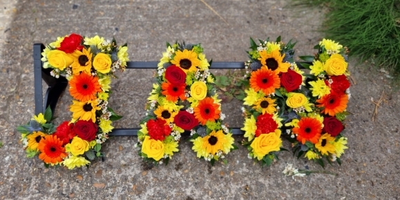 Wonderful mix of sunflowers, roses and daisies with thisle, carnations and fillers like wax and limonium.