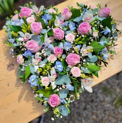 Please notice this is a  florist choice of flowers in light shades of pink and blue colours. By Croydon Blooms funeral florist covering Croydon, Addiscombe, Purley, Wallington, Waddon, Shirley, Selsdon, Sandearsted, South Croydon, West Croydon, New Addington, Addington Village, Elmers End, New Beckenham