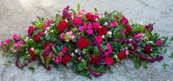 luxury blooms coffin spray by Croydon Funeral Florist