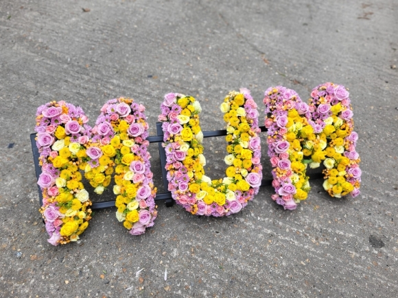 Mixed luxury letters made of spray roses, lisanthius and button daisies with 'highlight effect' to create amazing interesting printed look. by Croydon Blooms