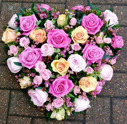 mixed pastels solid roses funeral heart by Croydon Blooms