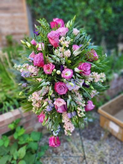 pink funeral standing spray for a service