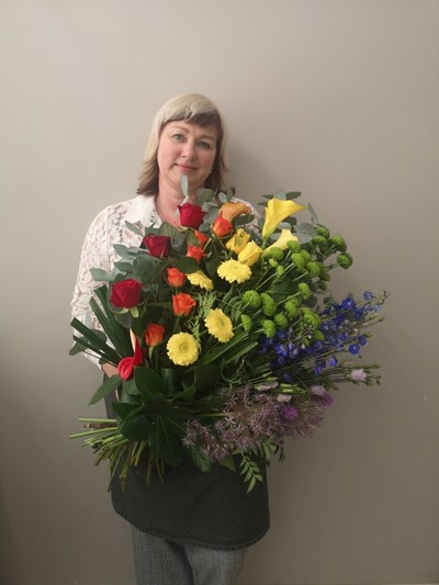Rainbow funeral flowers arranged by florist in Croydon, Surrey