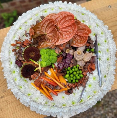 funeral flowers roast dinner on a posy pad