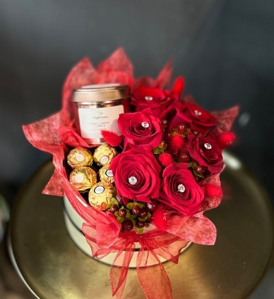 Amazing gift hat box with red roses, our daydreamer candle and Ferrero Rocher, made by florist in Croydon 