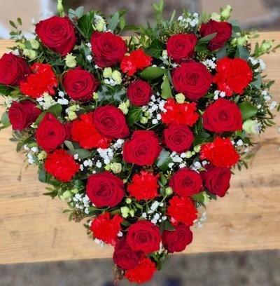 mixed roses and carnations solid heart made by Florist in Croydon