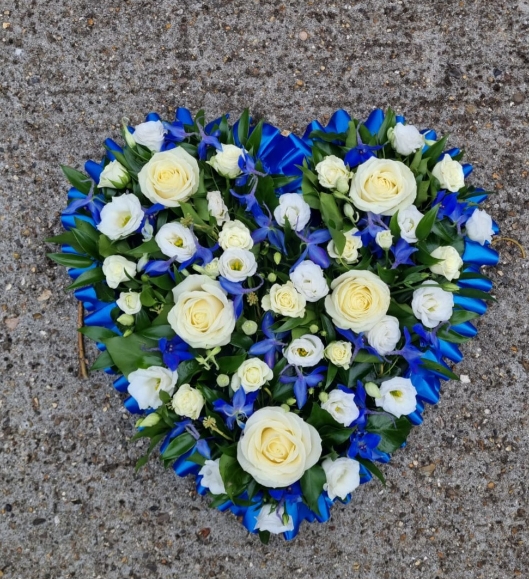 Mixed flowers solid heart with white and royal blue flowers, florist choice. By Croydon Blooms florist