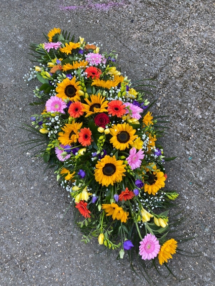Sunlit Farewell Coffin Spray made by florist in Croydon, Surreyt