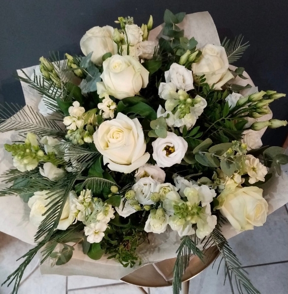 white lilies and roses hand tied with greenery arranged by florist in Croydon