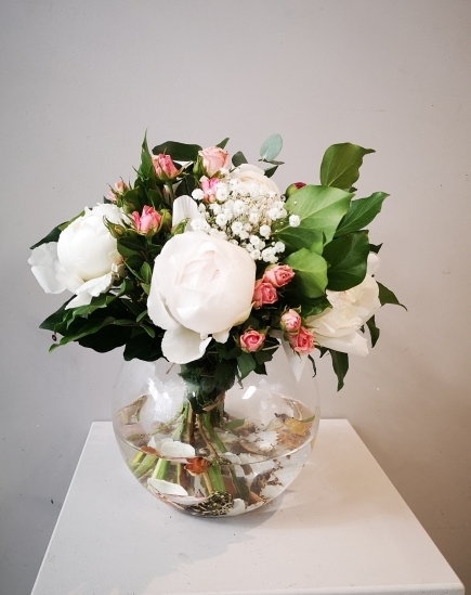 seashells in water in glass vase with pink peonies and greenery from Croydon Florist