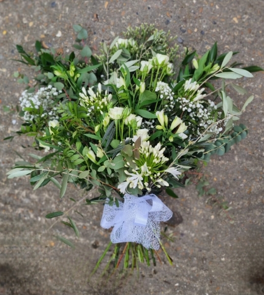 natural mix of foliagies with wax ,  freesias, small roses and gypsophilium by Croydon Blooms florist
