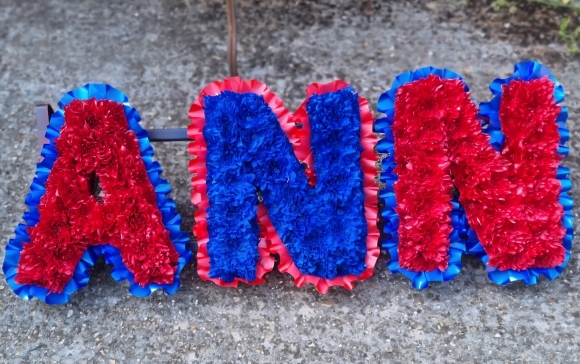 sprayed funeral letters by florist in Croydon