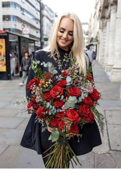 Stunning 24 red roses bouquet with fashionable fillers and foliages.  definitely gift to be remembered By florist in Croydon 