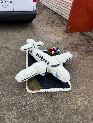 3D jet stream on designer board.  size of bottom board is 24inch x 36inch   any model od airplane can be done and personalised, please get in touch to discuss the design. Bespoke funeral flowers by florist in Croydon for delivery in South London