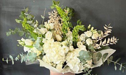 Stunning luxury all white bouquet made of hydrangeas and roses and dry elements made by florist in Croydon, Surrey, UK