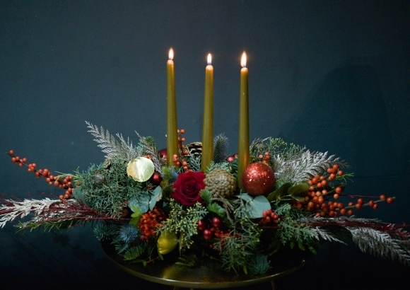 Christmas tabe centerpiece with candle handmade by local florist in Croydon