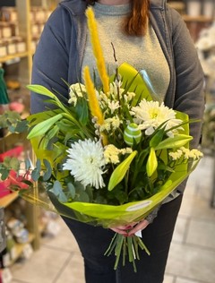Longi lily, pussy willow, eucalyptus, yellow grass, egg pick, agapanthus, limonium and blooms wrap perfect for a vase. Made by florist in Croydon 