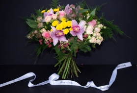 stylish bouquwr of mixed bright and pink flowers to include cymbidium orchid. Elegant design to resemble Paris evening, bouquet made by florist in Bromley, Kent, Uk