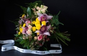 stylish bouquwr of mixed bright and pink flowers to include cymbidium orchid. Elegant design to resemble Paris evening, bouquet made by florist in Bromley, Kent, Uk