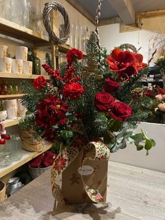 70 cm gift box arrangement to include Amaryllis, Roses, Carnations, Ilex, Pussy Willow, Eucalyptus, Pines, Blue spruce, gold tree ornaments with big hessian bow. Amazing long lasting gift to enjoy. Made by independent florist delivery in Croydon, Surrey, UK.