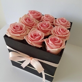 A set of Pink Roses in a hatbox by a Florist in Croydon