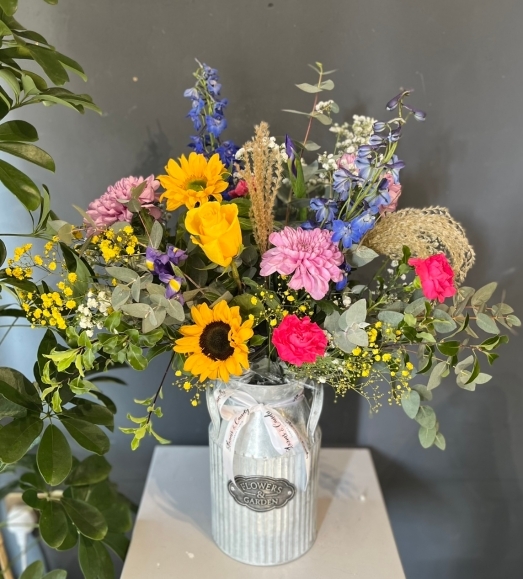 metal churn flowers arrangement for delivery in Croydon UK area