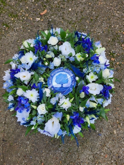 This is a florist choice of stems mixed flowers posy pad in matching colours of logo. Photo also can be accommodated. By Croydon Blooms Florist from Croydon 