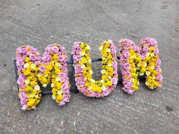 Mixed luxury letters made of spray roses, lisanthius and button daisies with 'highlight effect' to create amazing interesting printed look. by Croydon Blooms