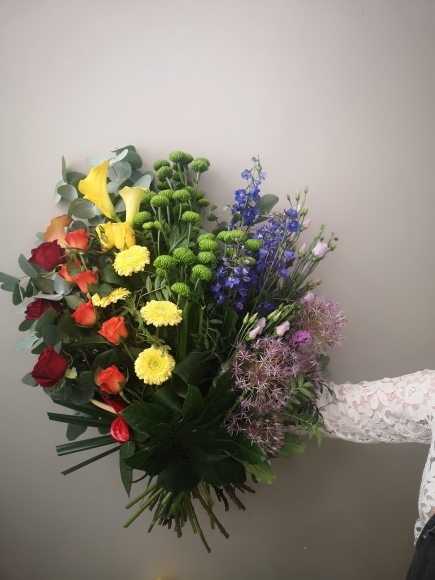 Rainbow funeral flowers arranged by florist in Croydon, Surrey