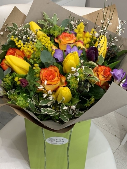 Yellow tulips and orange roses spring flowers bouquet handmade by independent florist in Croydon