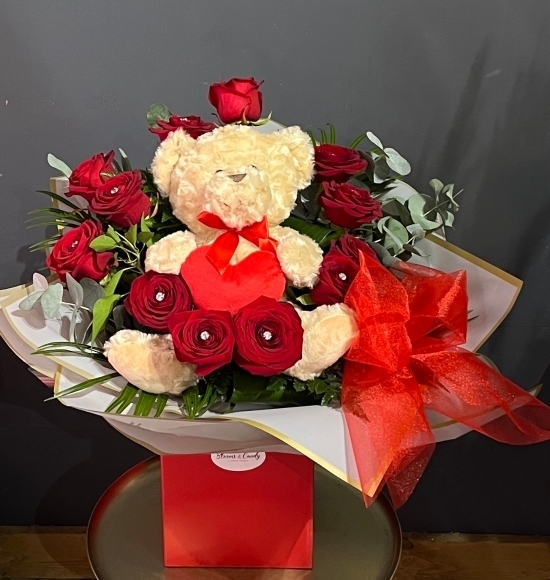 This is stunning roses bouquet with incorporated soft 25 cm teddy toy. Roses are decorated with crystal pins.  Amazing Valentine's gift to surprise made by florist in Croydon