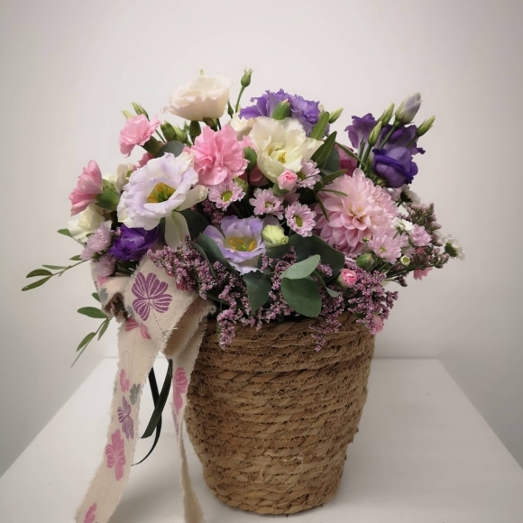 flowers round posy arrangement in natural round basket made by independent florist in Croydon, Surrey